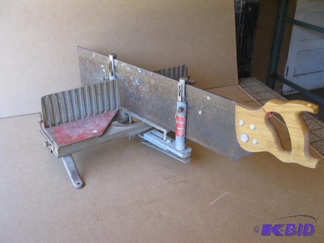 lot 53 image: Old 24 inch miter saw, heavy, works good...
