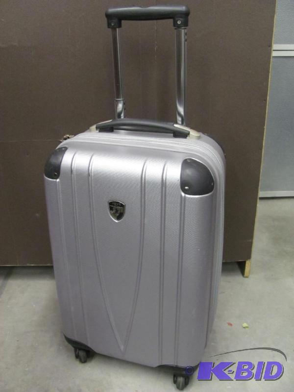 lot 83 image: This HEYS Expandable Suitcase with wheels is ...