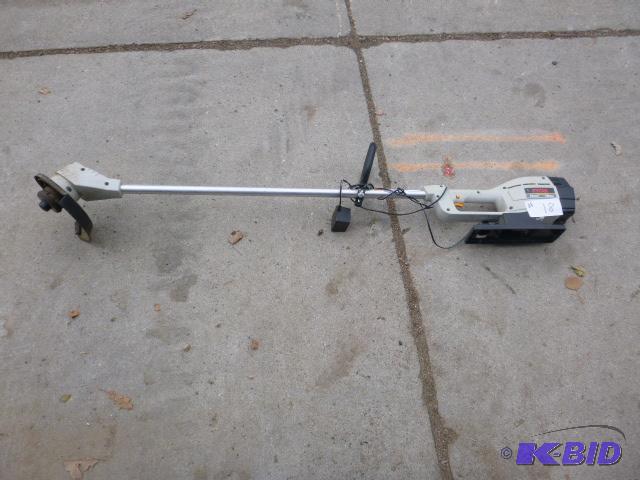 lot 18 image: Ryobi&nbspCordless Trimmer with Charger 155R...