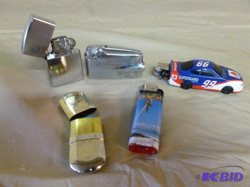 lot 166 image: Lot of five collectible cigarette lighters....