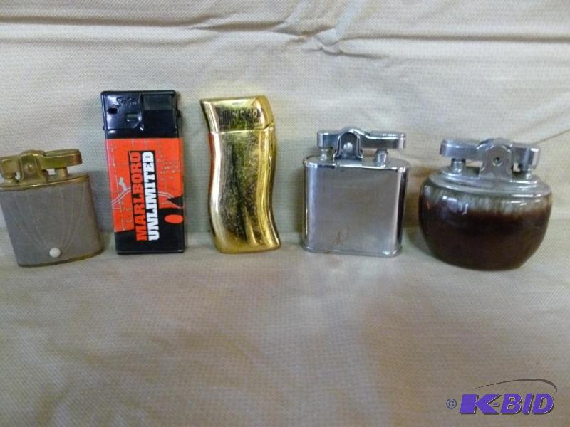 lot 169 image: Lot of five collectible cigarette lighters....