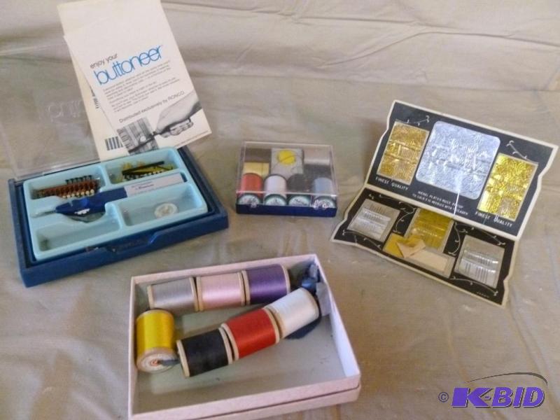 lot 220 image: Lot of sewing items that includes thread, nee...