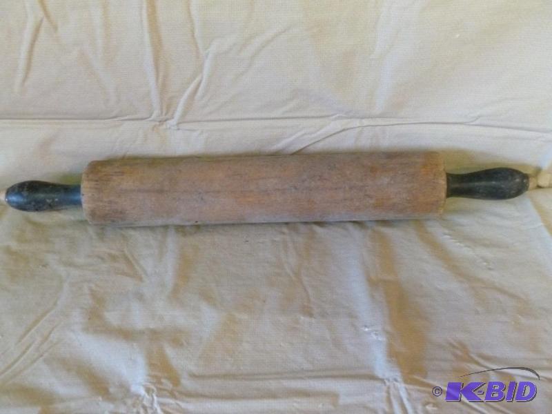 lot 41 image: Large vintage black handled wooden rolling pi...