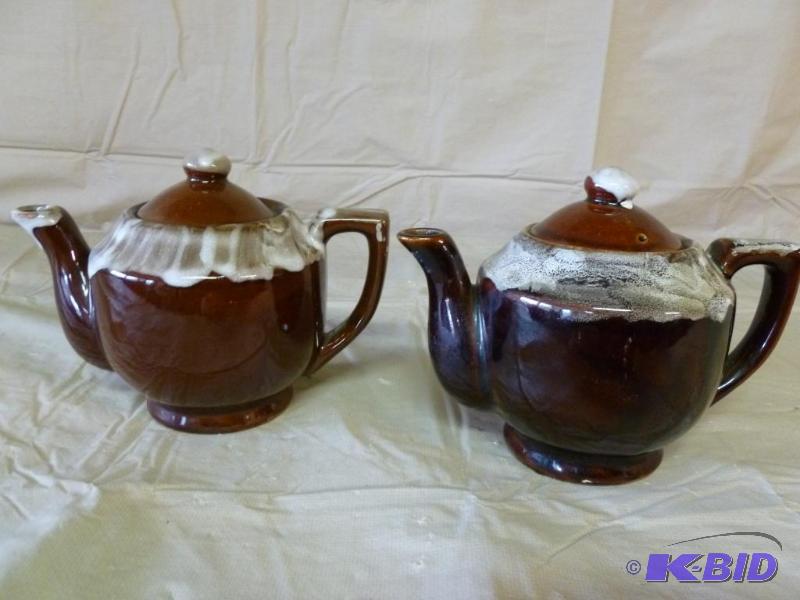 lot 83 image: Lot of two porcelain tea pots that measures a...