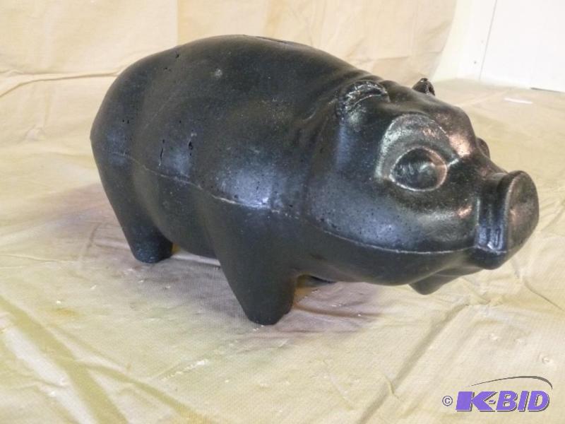 lot 86 image: Large molded plastic pig coin bank that measu...