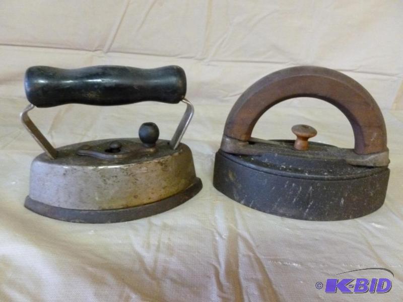 lot 98 image: Lot of two vintage irons with handles....