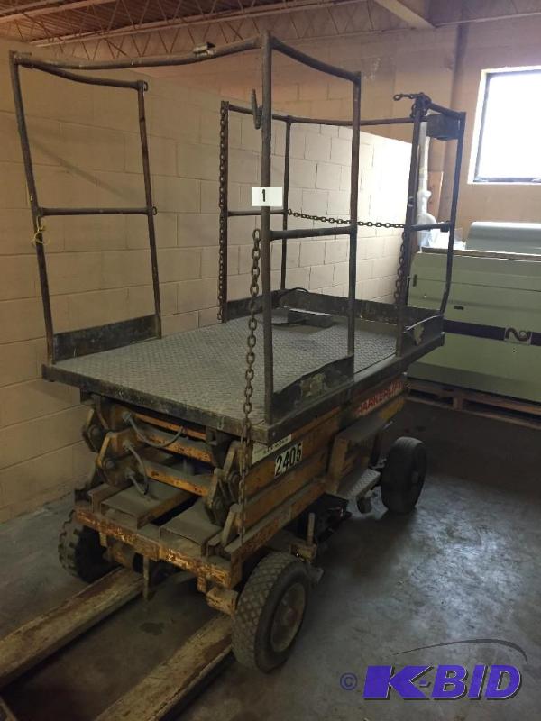 lot 1 image: Parker hoist  scissor lift. Works, but needs...