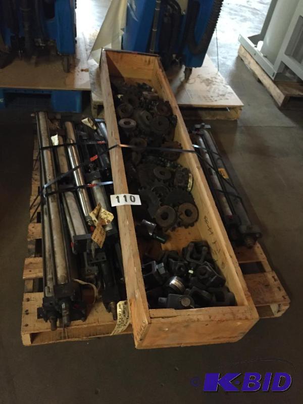 lot 110 image: Pallet lot of misc metal rams, gears, and U j...