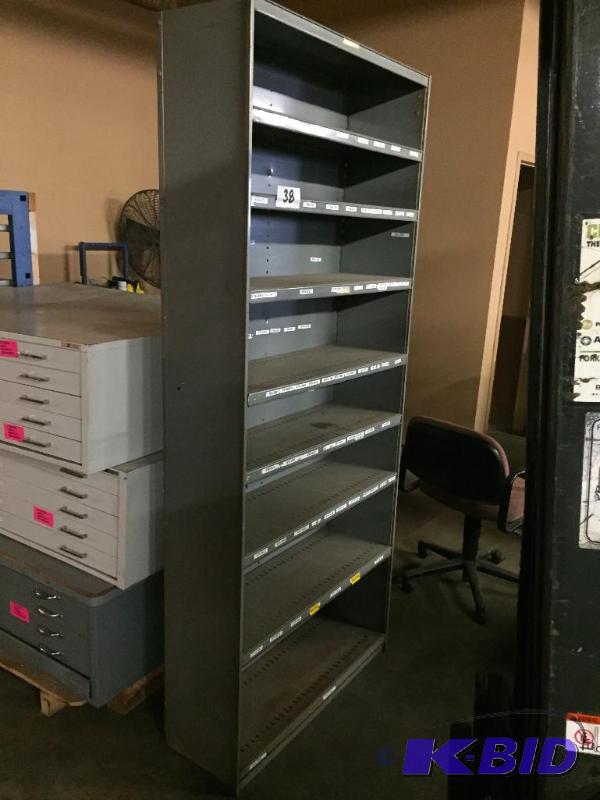 lot 38 image: Tall shallow metal shelf unit....