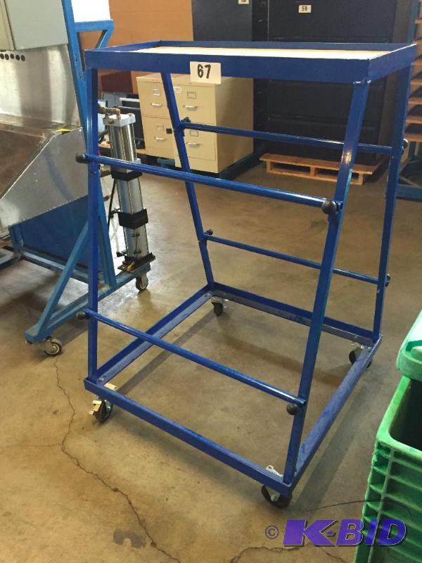 lot 67 image: Metal spool rack on casters....
