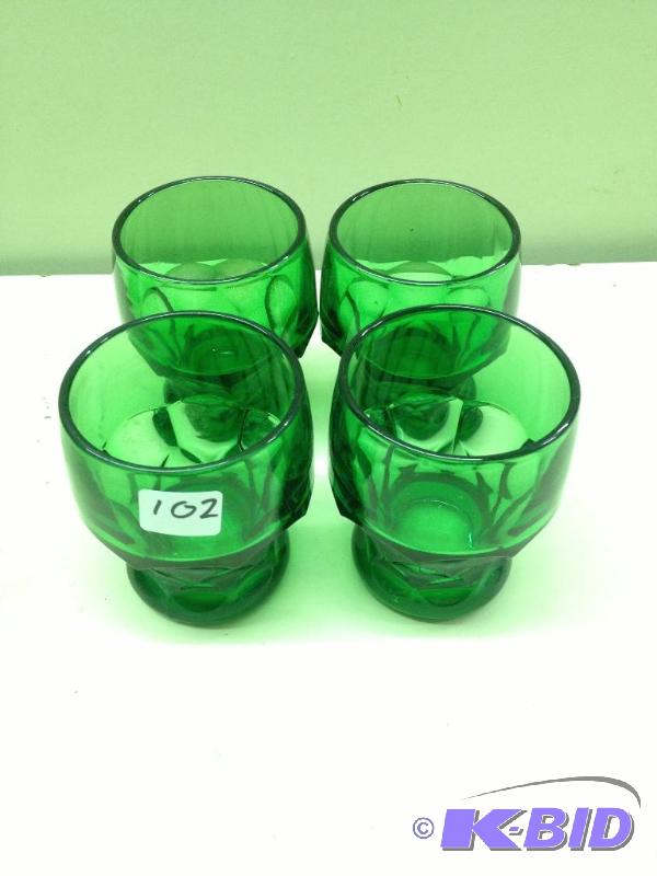lot 102 image: Green Depression Glass  Set of 4 Glasses...