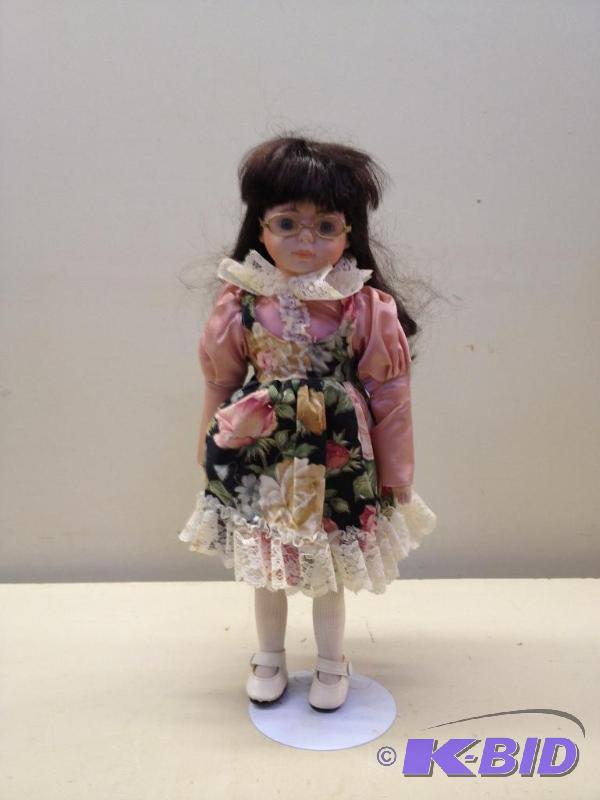 lot 81 image: Porcelain Doll...