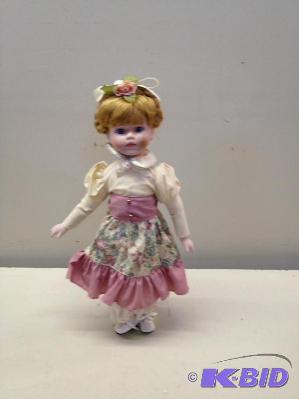 lot 82 image: Porcelain Doll...