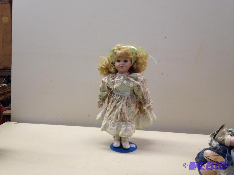 lot 84 image: Porcelain Doll...