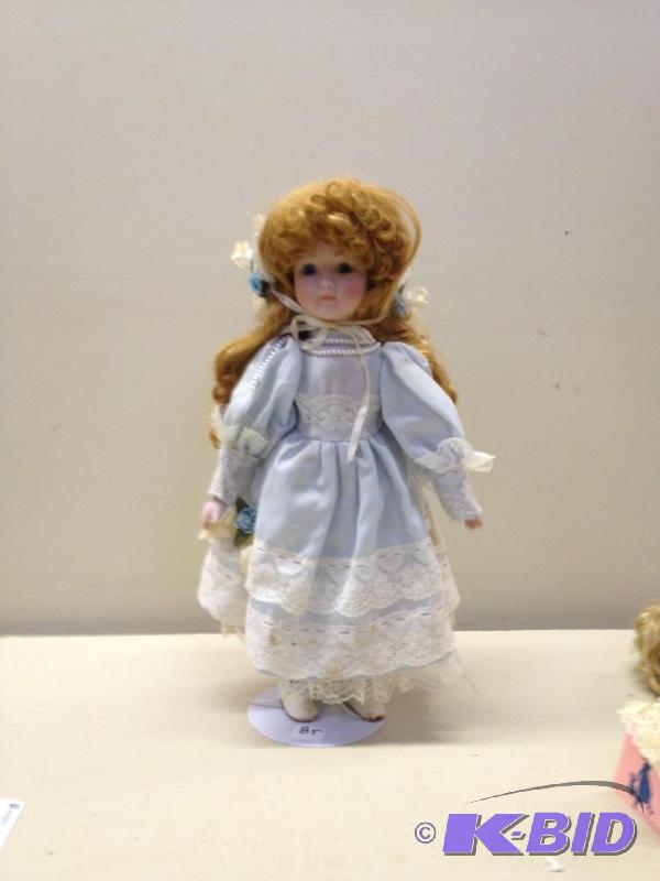 lot 85 image: Porcelain Doll...