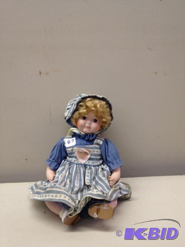 lot 87 image: Porcelain Doll...