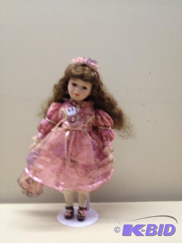 lot 89 image: Porcelain Doll...