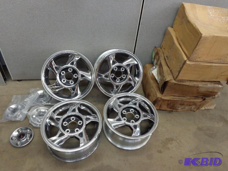 lot 177 image: 5 Hole Chrome Rims   GM Stamped  Pontiac Stud...