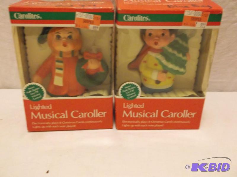 lot 101 image: Lot with 2 lighted musical carolers....