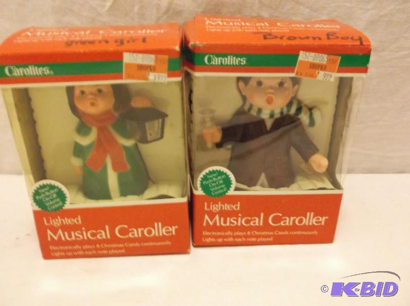 lot 102 image: Lot with 2 lighted musical carolers....