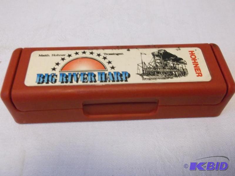 lot 25 image: Hohner harmonica like new in case i believe M...