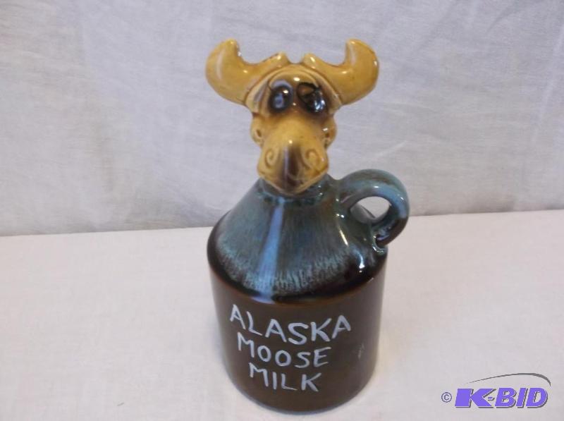 lot 33 image: Alaska Moose milk jug in good condition....