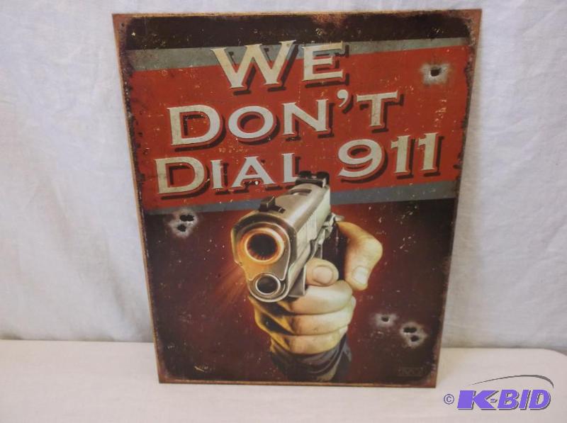 lot 52 image: We Dont Dial 911 metal sign measuring 12 12...