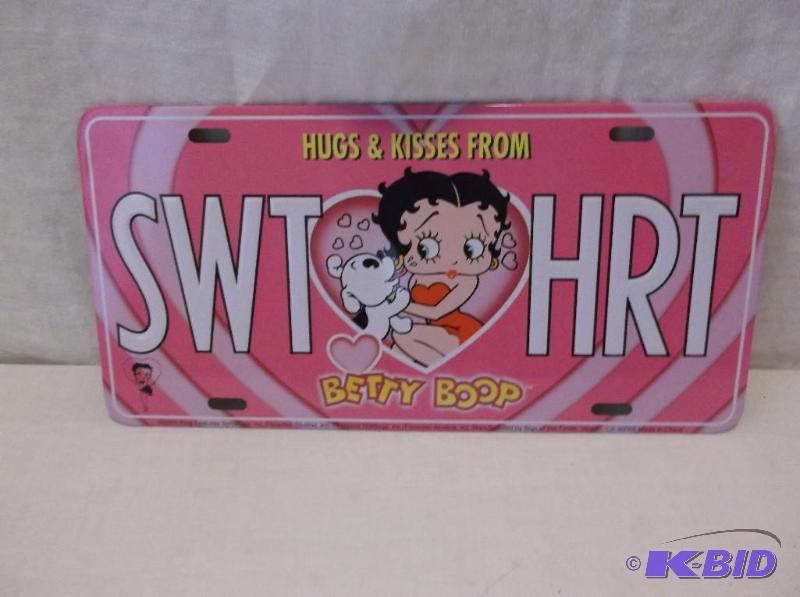 lot 53 image: Embossed metal license plate sign....