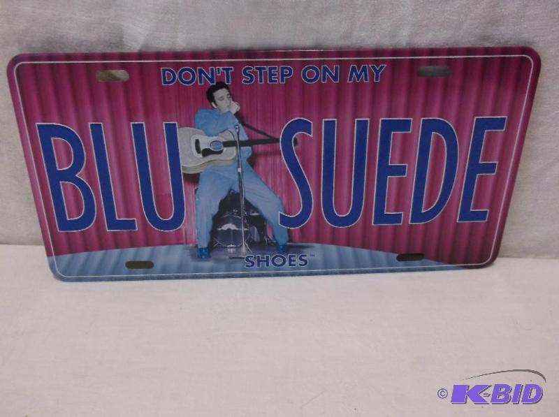 lot 56 image: Embossed metal license plate sign....