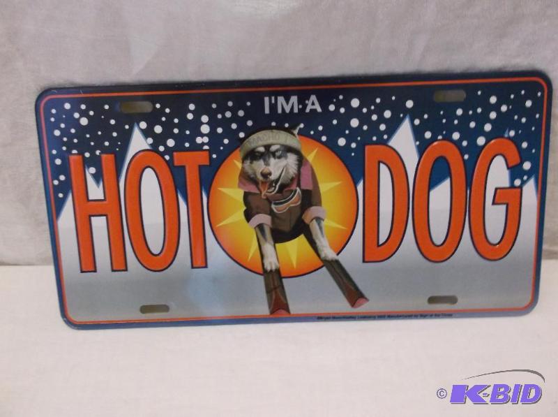 lot 57 image: Embossed metal license plate sign....