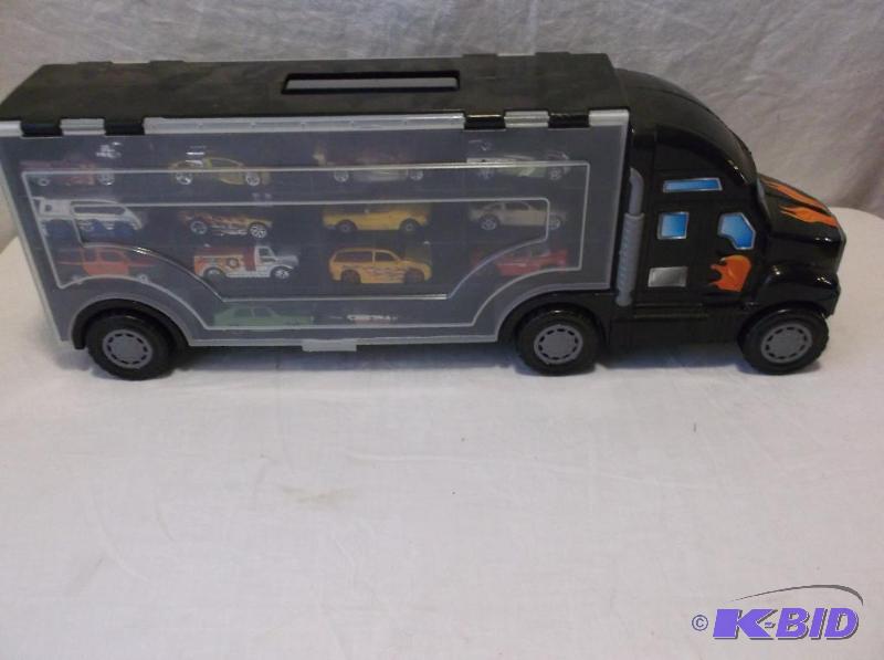 lot 70 image: Car hauler loaded with cars....