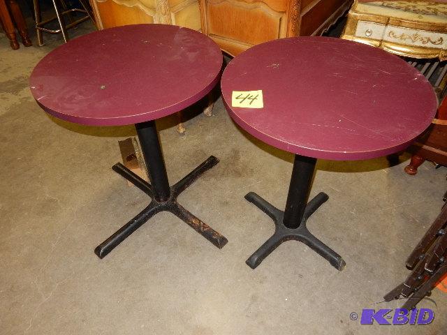 2 round tables.. One has a larger base.. 1, 2...