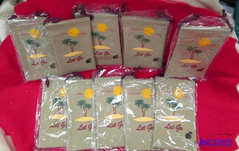 lot 158 image: Qty 10 small tan bags that has a tree with su...