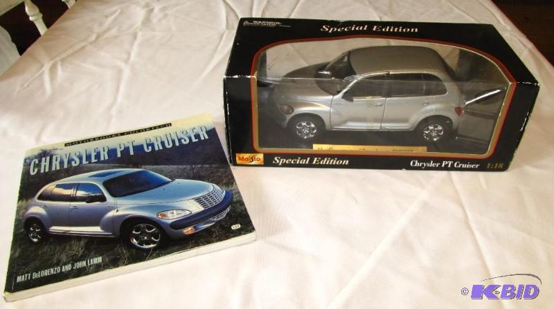 lot 19 image: Maisto Chrysler PT Cruiser model & book....