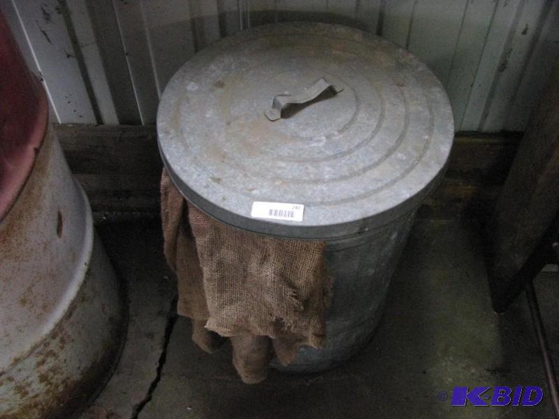 lot 240 image: Galvanized Can & Lid filled with corn fee...
