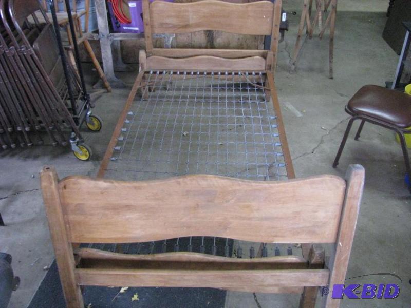 lot 242 image: Antique Trundle Bed. Wood headfood board wit...