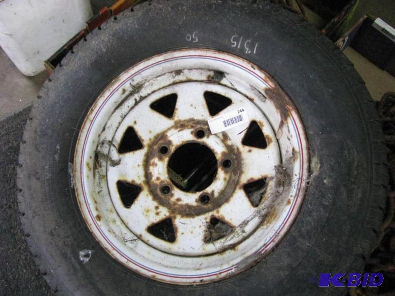 lot 244 image: Tire & Rim. Inflated...