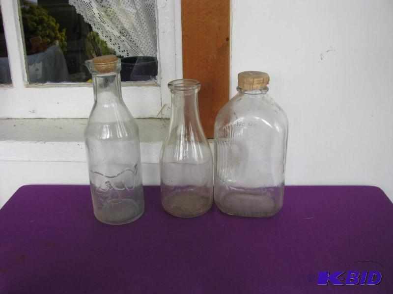 lot 335 image: vintage glass milk bottles...