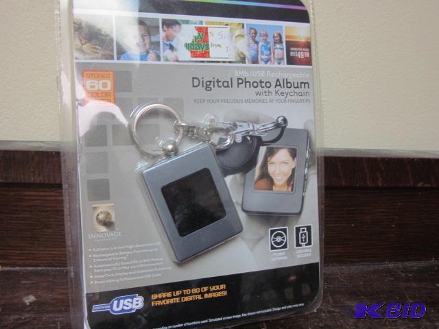 lot 131 image: Digital photo album key chain with software a...