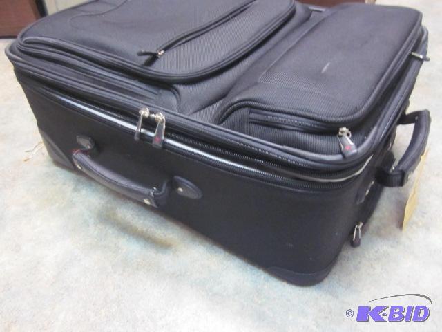 lot 135 image: Large black roller suitcase in good condition...