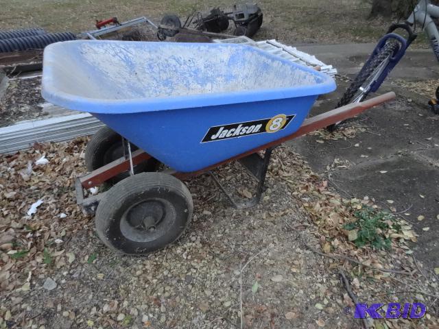 lot 12 image: Double tire wheel barrow. Tub has 2 cracks. S...