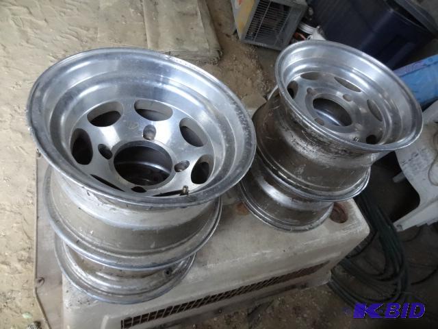 lot 26 image: 4 aluminum ATV rims. 4 hole. part # Kit 435L....