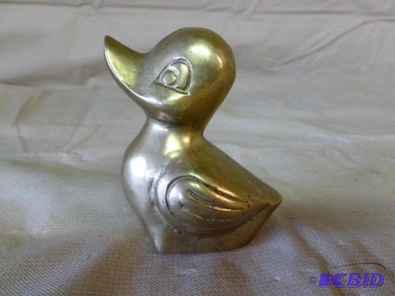 lot 60 image: Vintage cast brass duck figurine that measure...