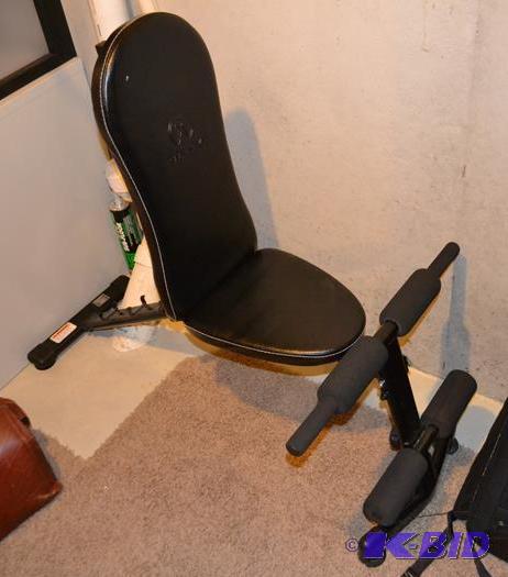lot 105 image: Marcy adjustable weight bench. On lower level...