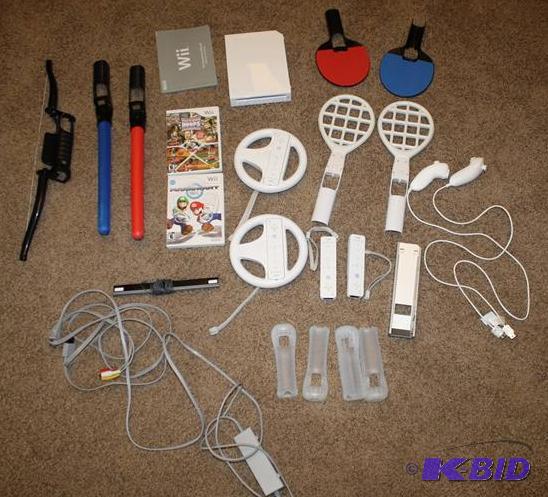lot 25 image: Wii model RVL001 with accessories pictured. I...