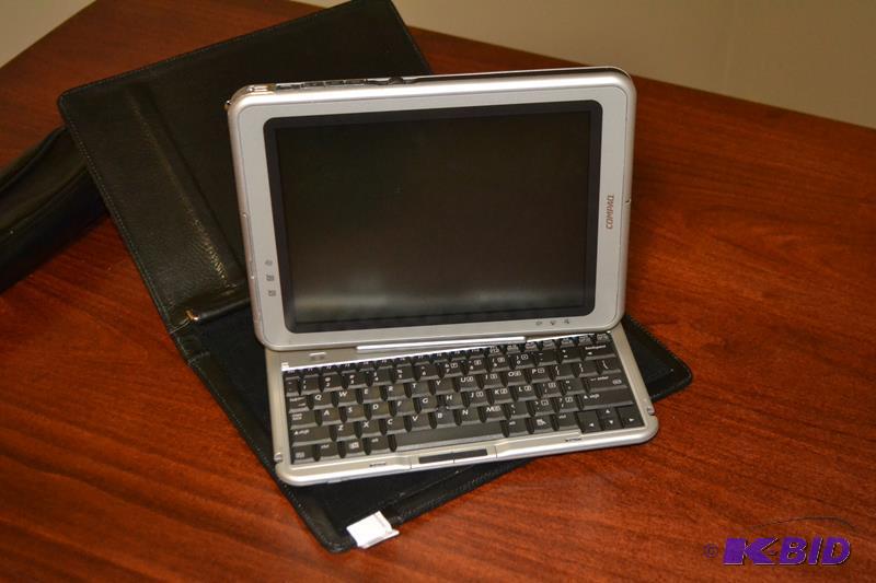 lot 41 image: Compaq tablet computer and docking keyboard. ...