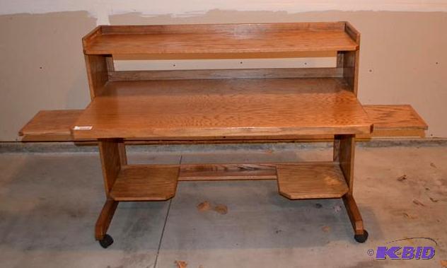 lot 52 image: Wood Computer desk on wheels with two pull ou...