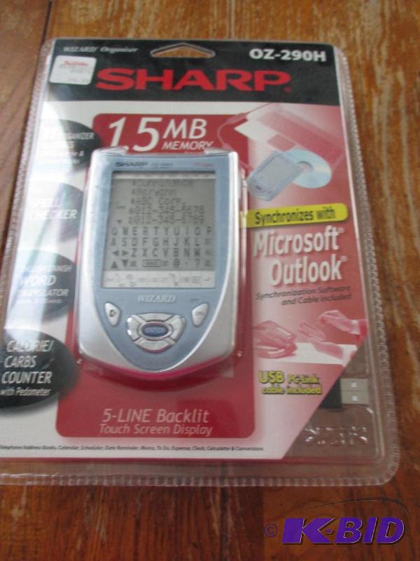 lot 49 image: Sharp Wizard organizer- new in package syncs ...