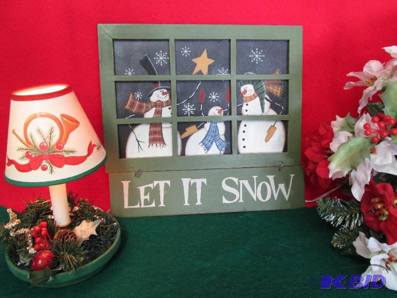 A Christmas Light and a Window Full of Snowmen