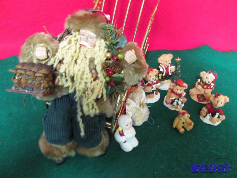 Woodland Santa sits on a Gold Sleigh 
